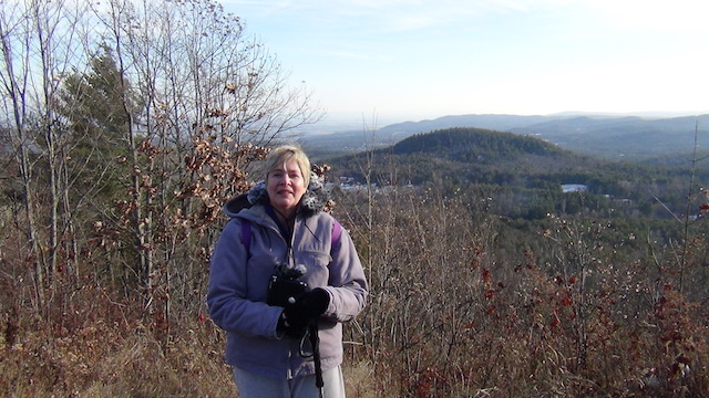 The ascent was 120 feet and it made a lot of difference. The hat and hood is about to go on again. And note how fewer brown leaves are on these trees, compared to earlier in the trail.