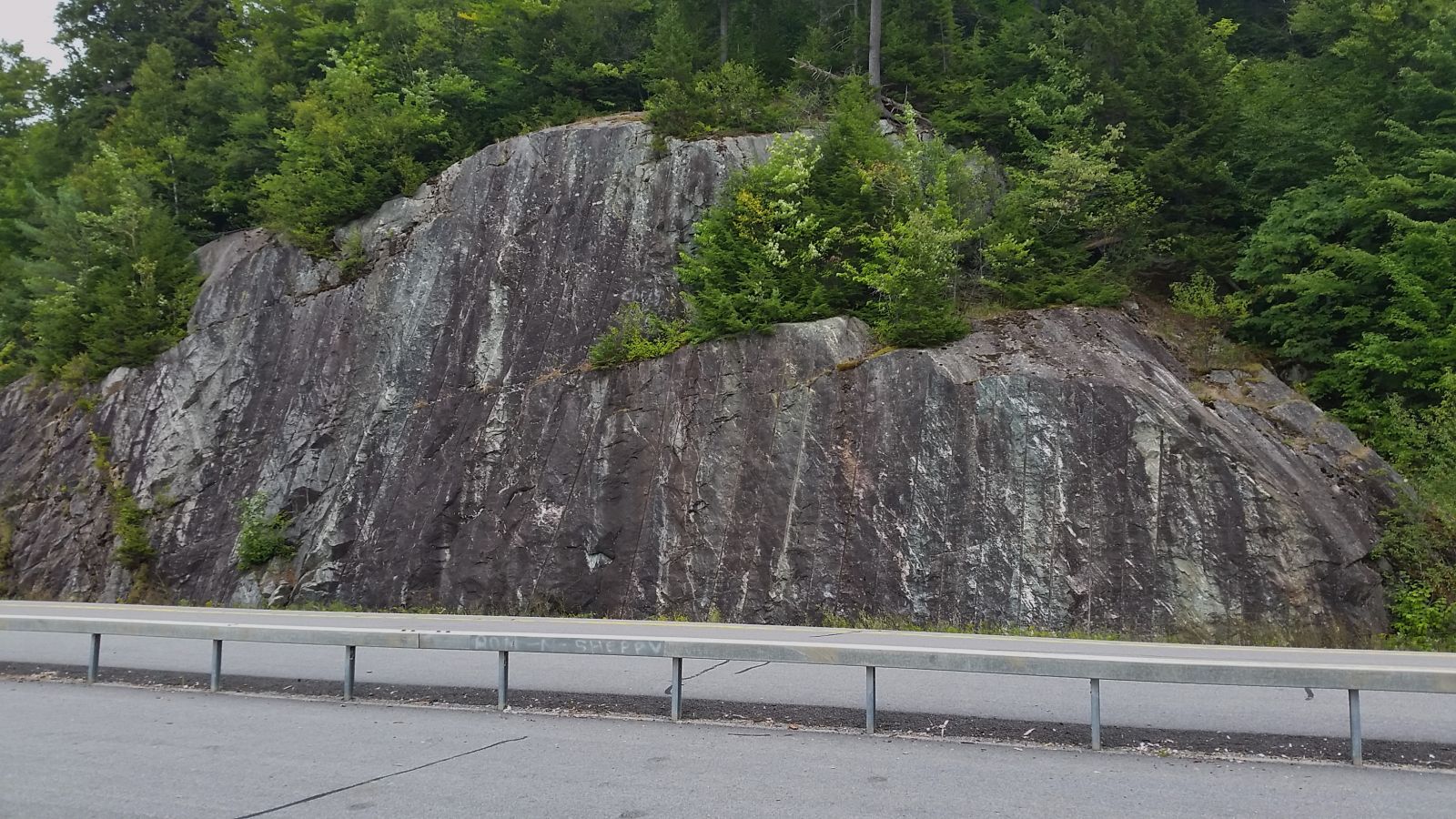 The rocks cliffs - see the vertical lines.