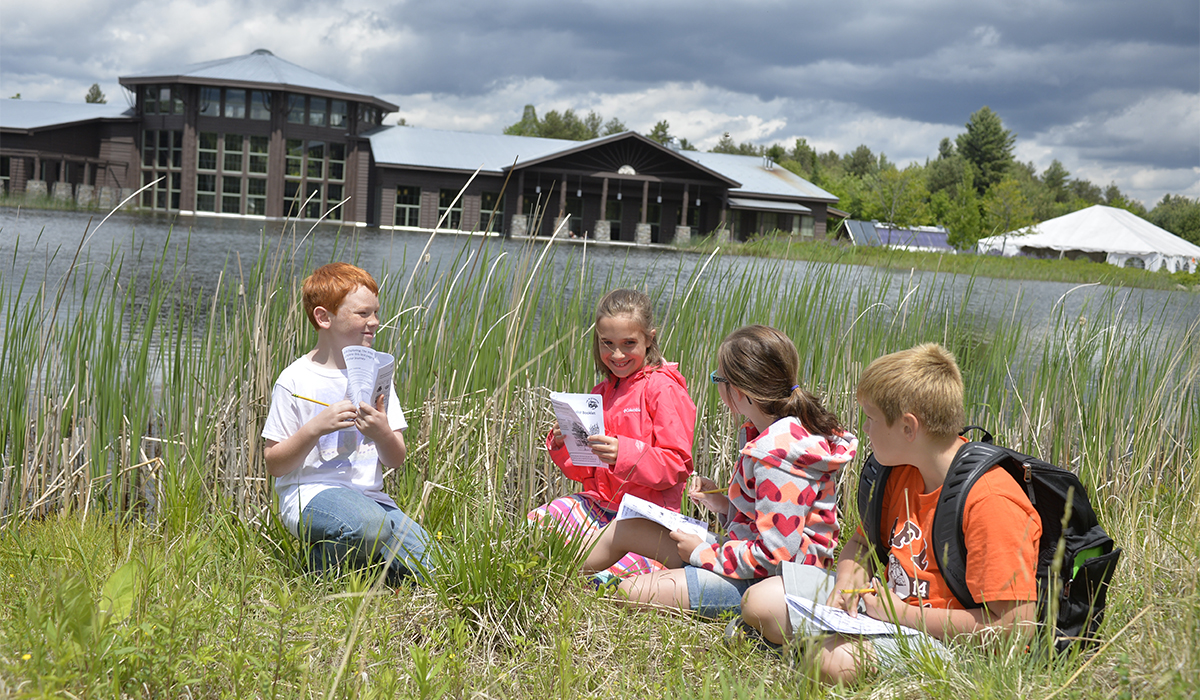 Youngsters working hard to earn their Jr. Naturalist Patch - The Wild Center photo