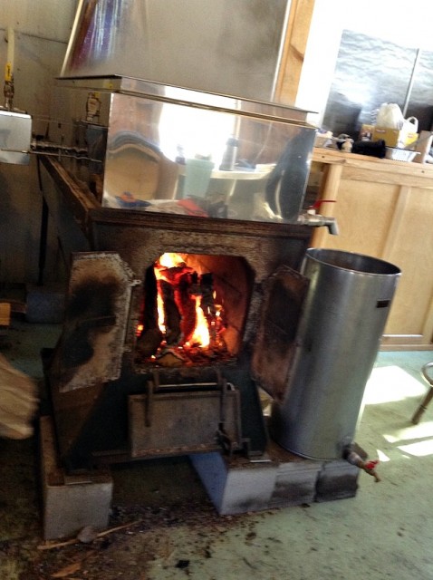 This is a wood-fired evaporator, as seen by the orange glow in its center.