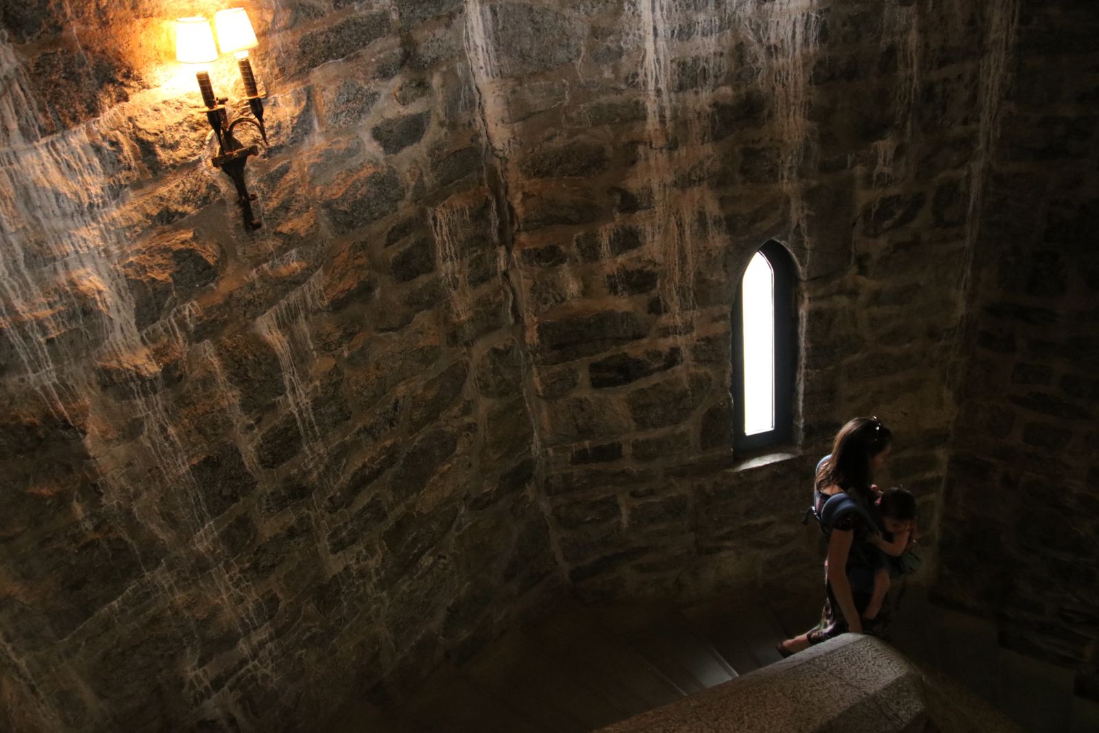 Rock walls, rock stairs, narrow windows, and a candle light glow — yep, it's a castle!