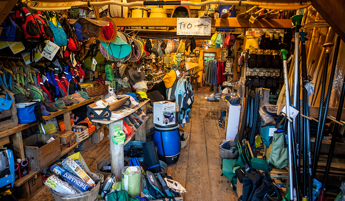Browsing through the inventory at Raquette River Outfitters in Tupper Lake