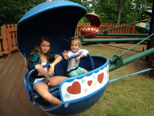 Rae is a great big sis, taking Julia on the Christmas Tree Ride!