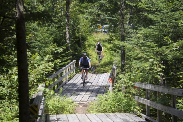 Riders, beginning their descent from the top of "Poor Man's Downhill"