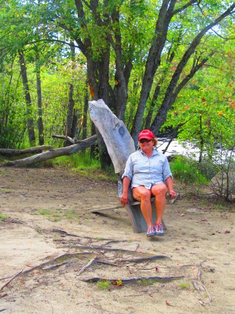 Anne testing the rustic Adirondack Chair