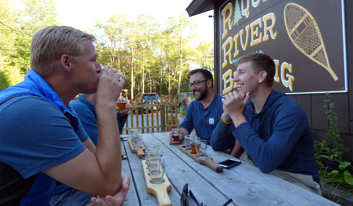 Fellow beer lovers sampling some brew at Raquette River Brewing.
