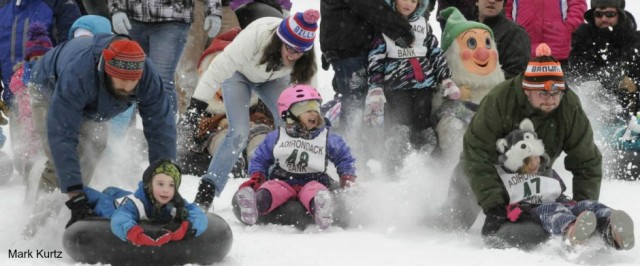 we multiply the fun during Winter Carnival by holding inner tube races we multiply the fun during Winter Carnival by holding inner tube races