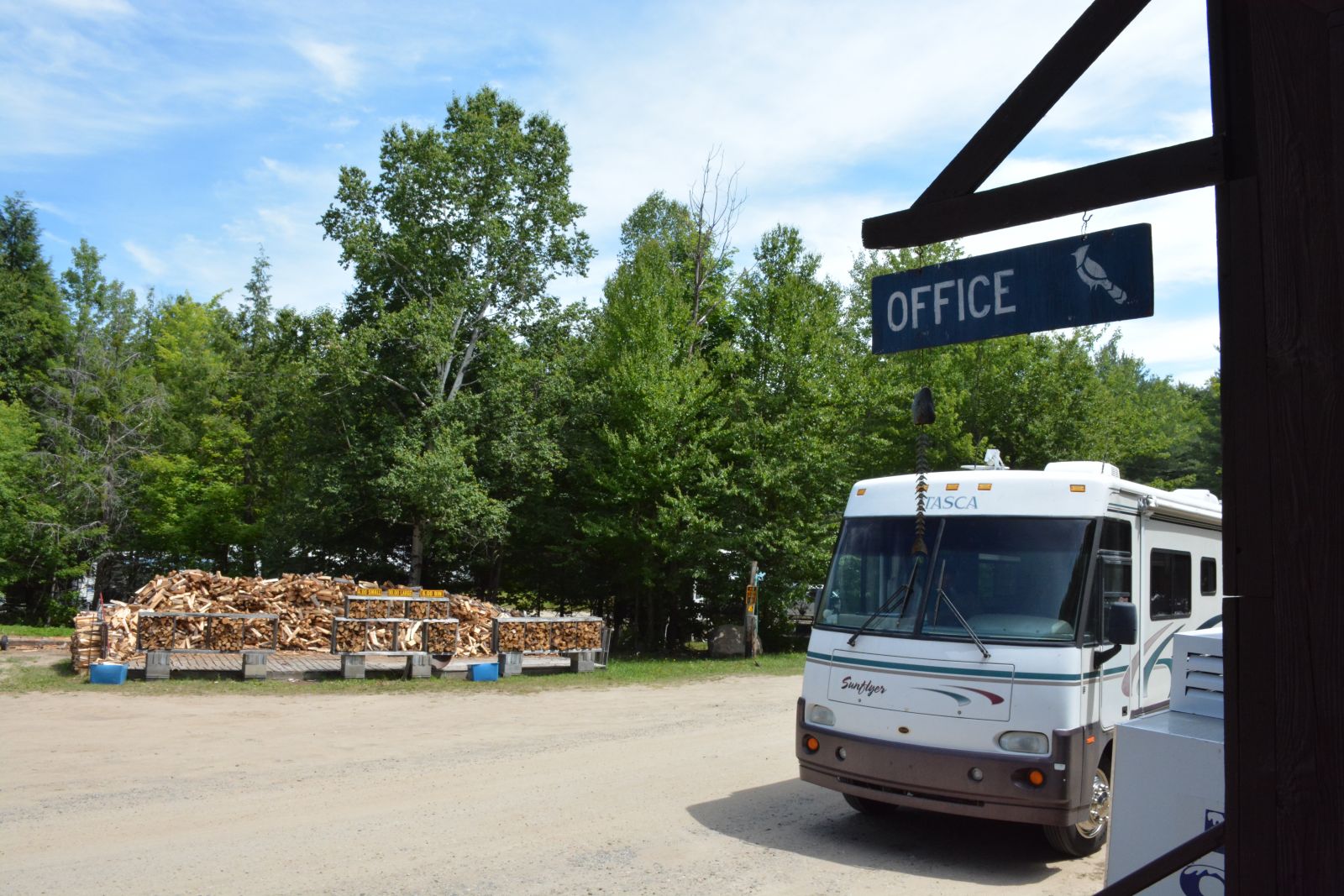 Campers stop by the Blue Jay Campsite office to check in for their stay at the Adirondack campground.