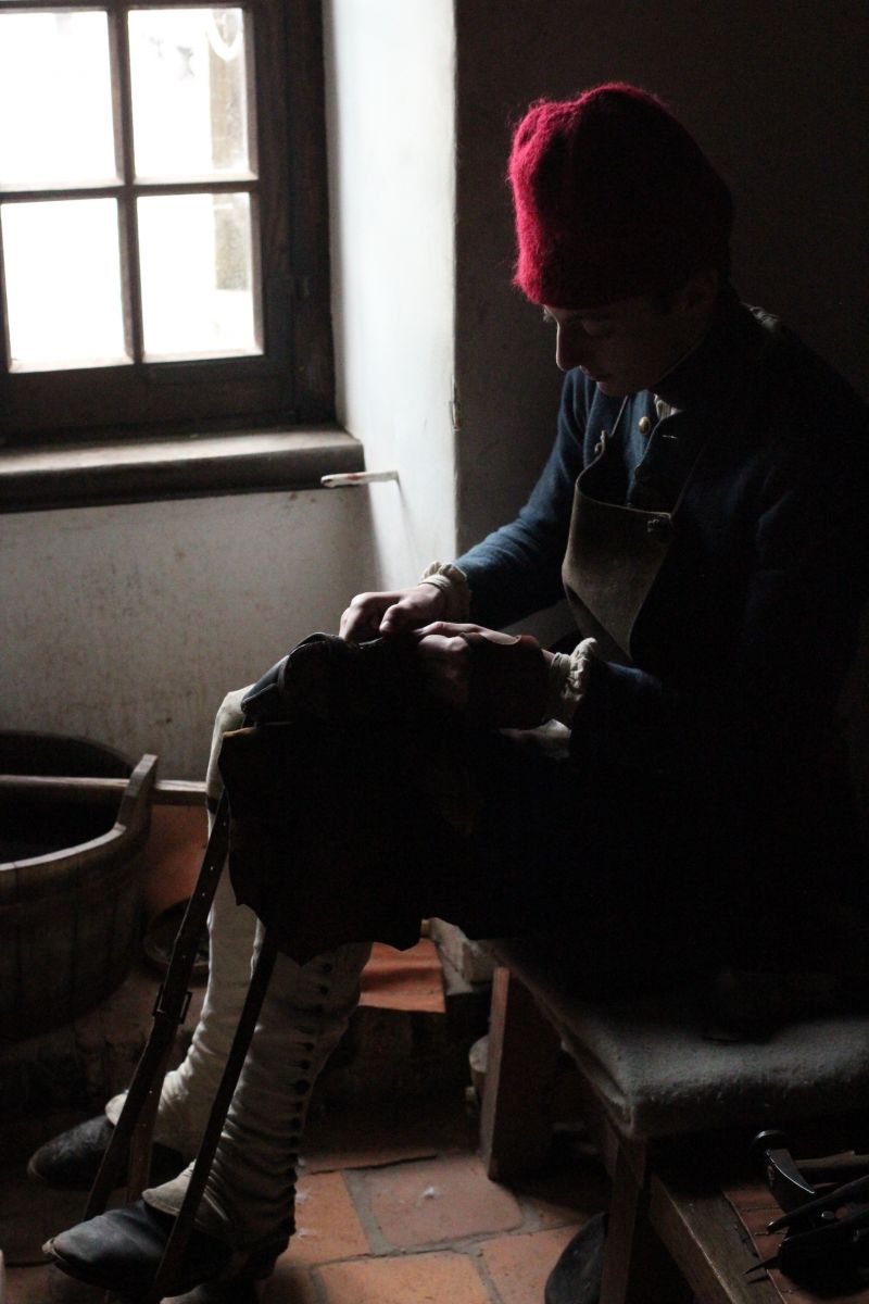 A "soldier" at work in the shoemakers shop.