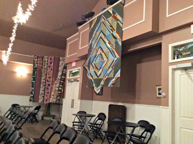 The back of the theater has several tables for gatherings and snacks.