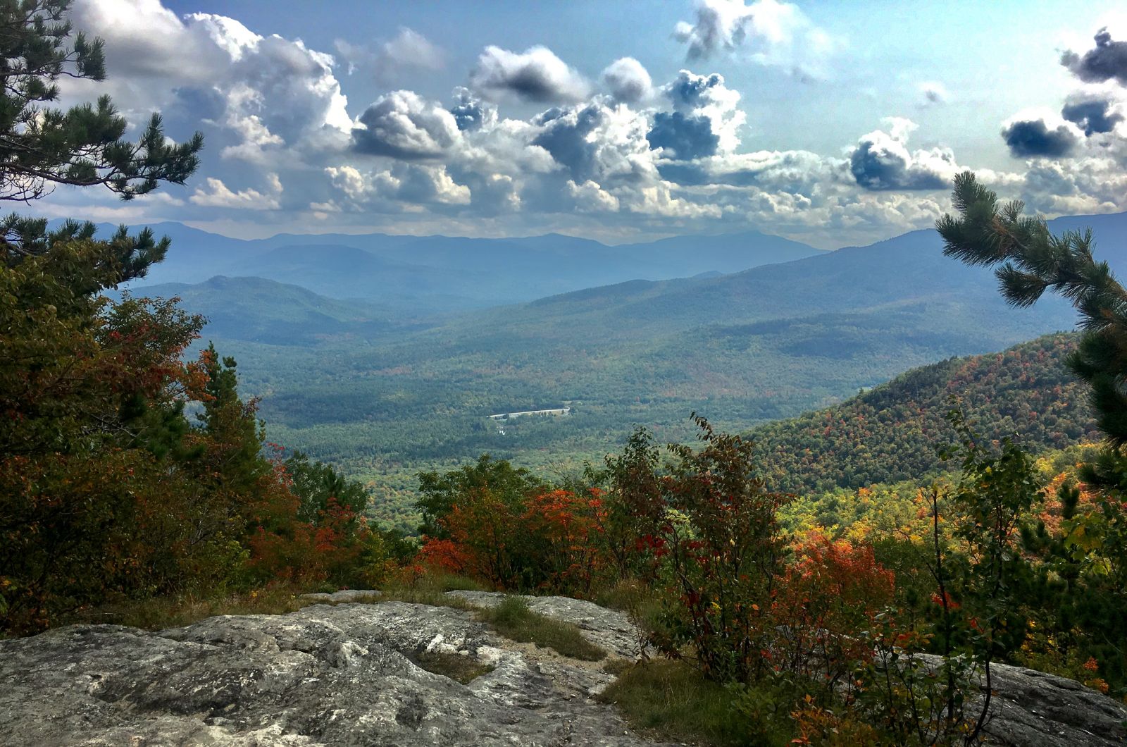 The summertime panoramic view from Marble Mountain with the Ausable River Valley below.