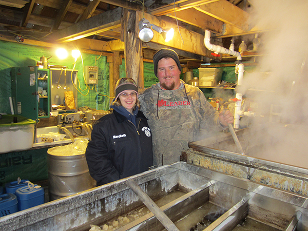 Kevin and MaryBeth Sayre inside their sugar shack.