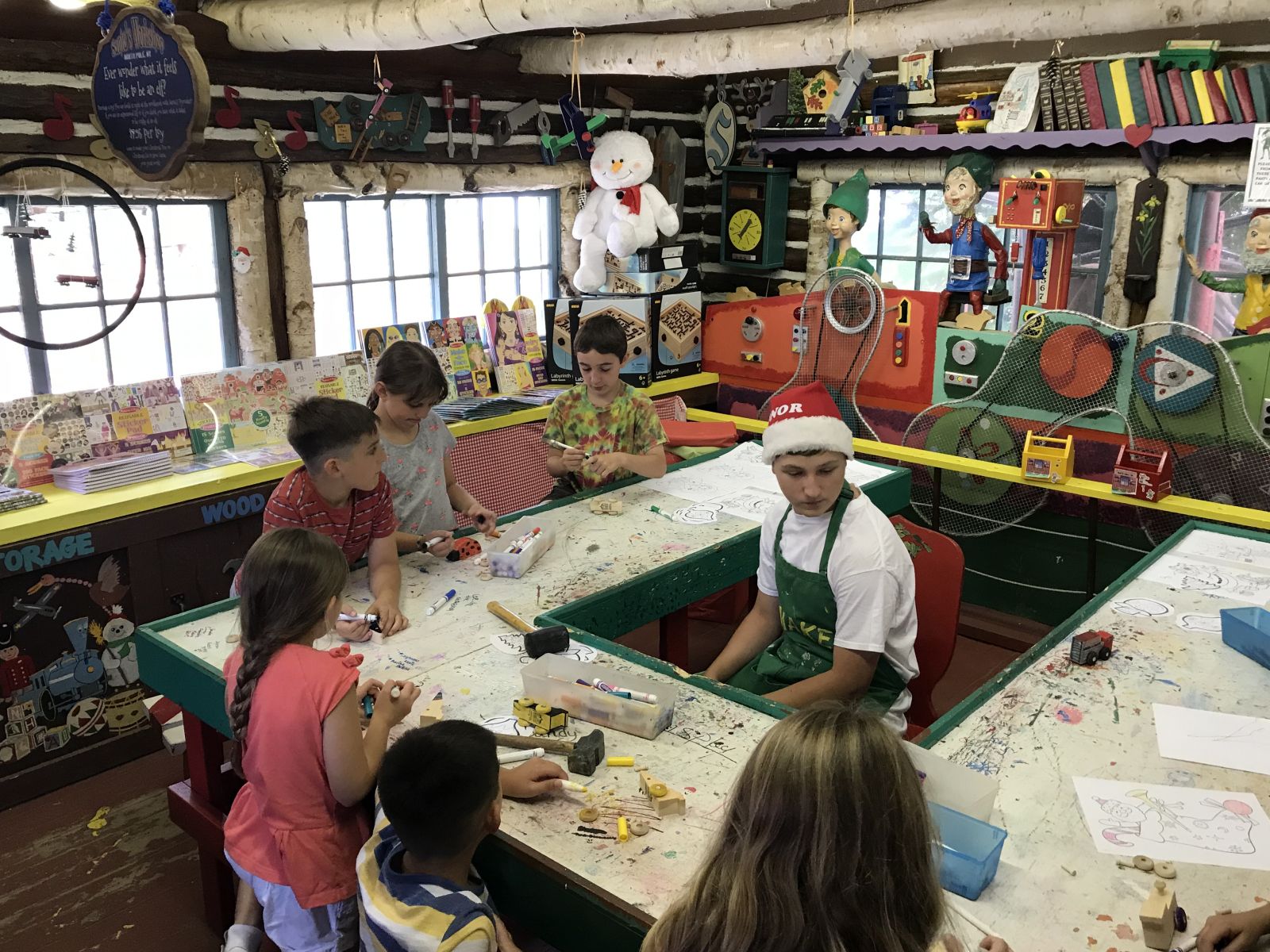Learning the tricks of the trade from one of Santa's helpers.