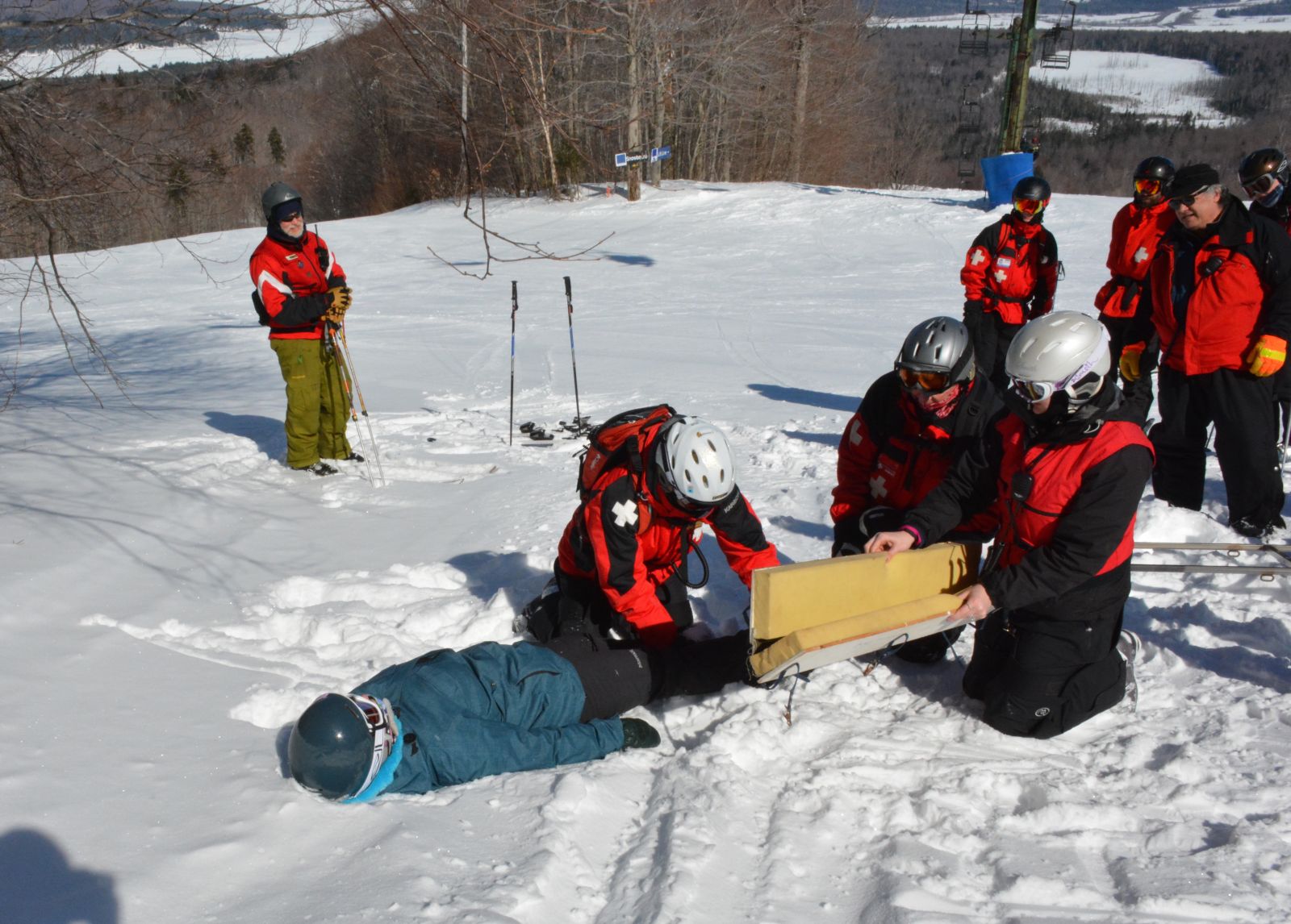 Patrollers Nancy Merrihew, Amanda Merrihew, and Charlie Hoffer handle the first training scenario, while the rest of the group observes.