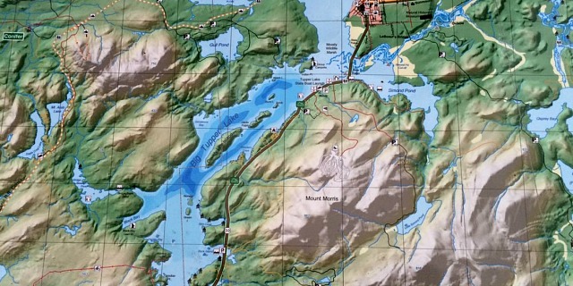 Large mountains dumping lots of pristine snow melt into rugged shorelines with islands. Fish love that.