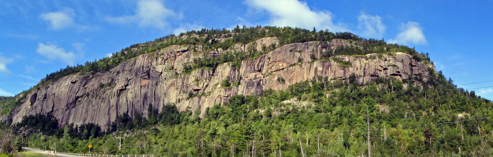 The cliffs of Poke-O-Moonshine are famous for rock climbing, raptor watching, and enjoyable hiking along two different paths.