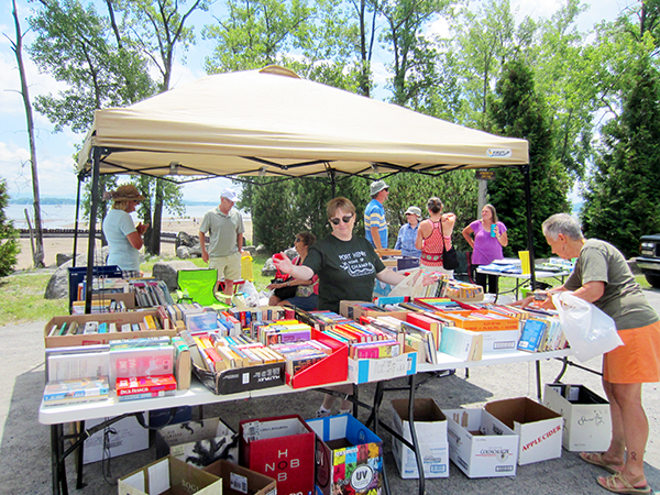 Michelle Pacquette, of the Sherman Free Library, beckons the bibliophiles.