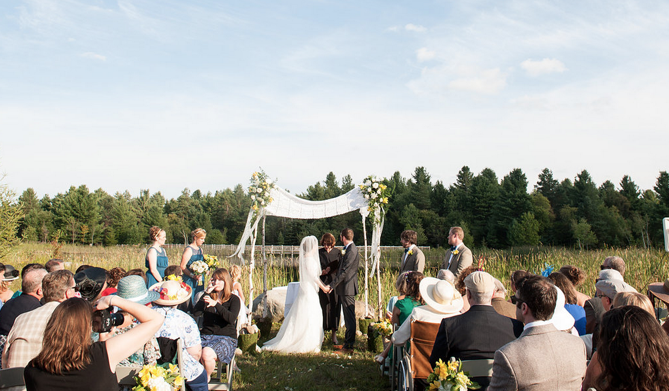Jodie & Stephen exchange vows at The Wild Center (Photo courtesy of Jared & Debbie Weddings)