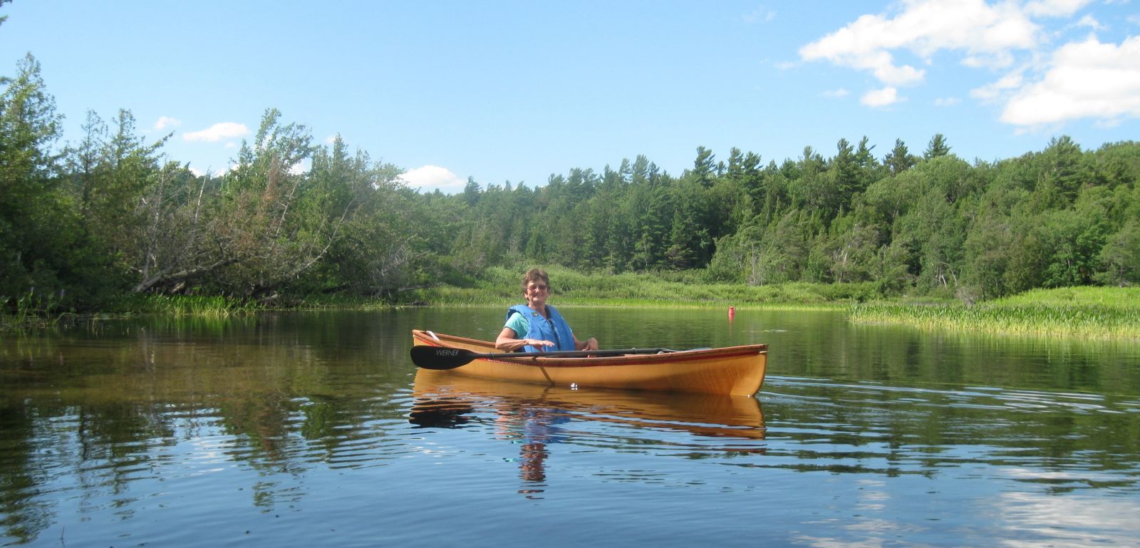 Elaine on the Saranac River, heading back to South Creek.