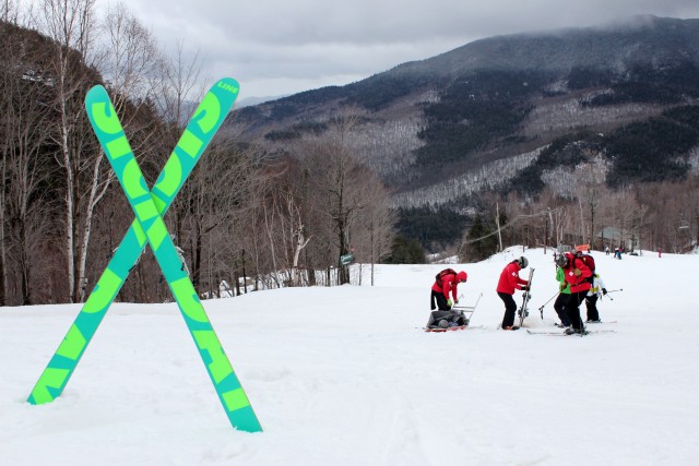 Members of the Whiteface ski patrol prepare to help an injured skier off the mountain.