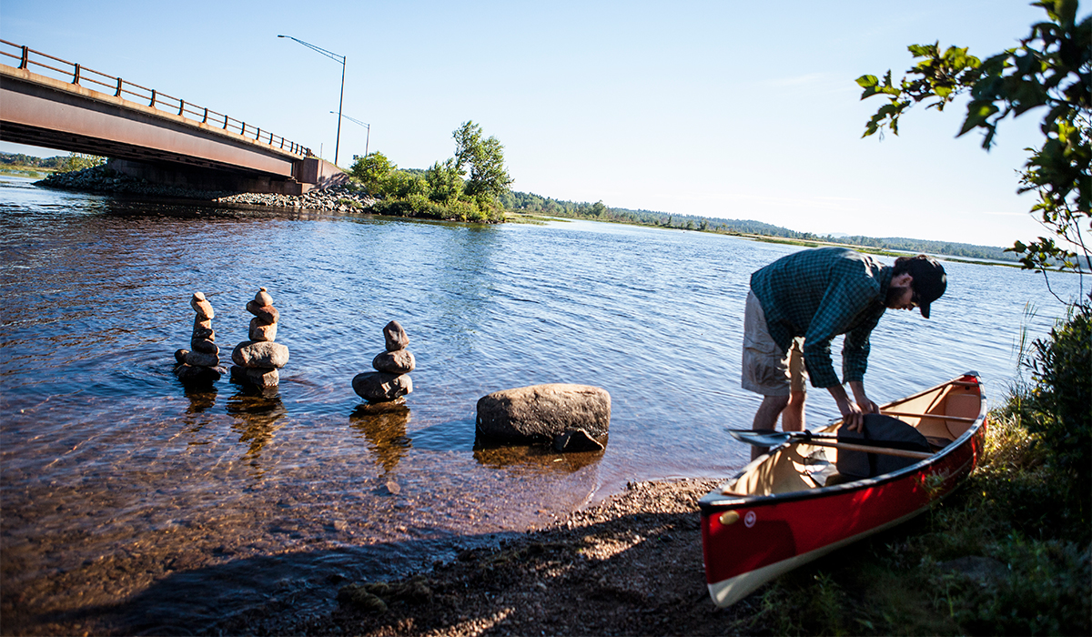 Launching a pack basket canoe for Raquette River Outfitters convenient launch point.