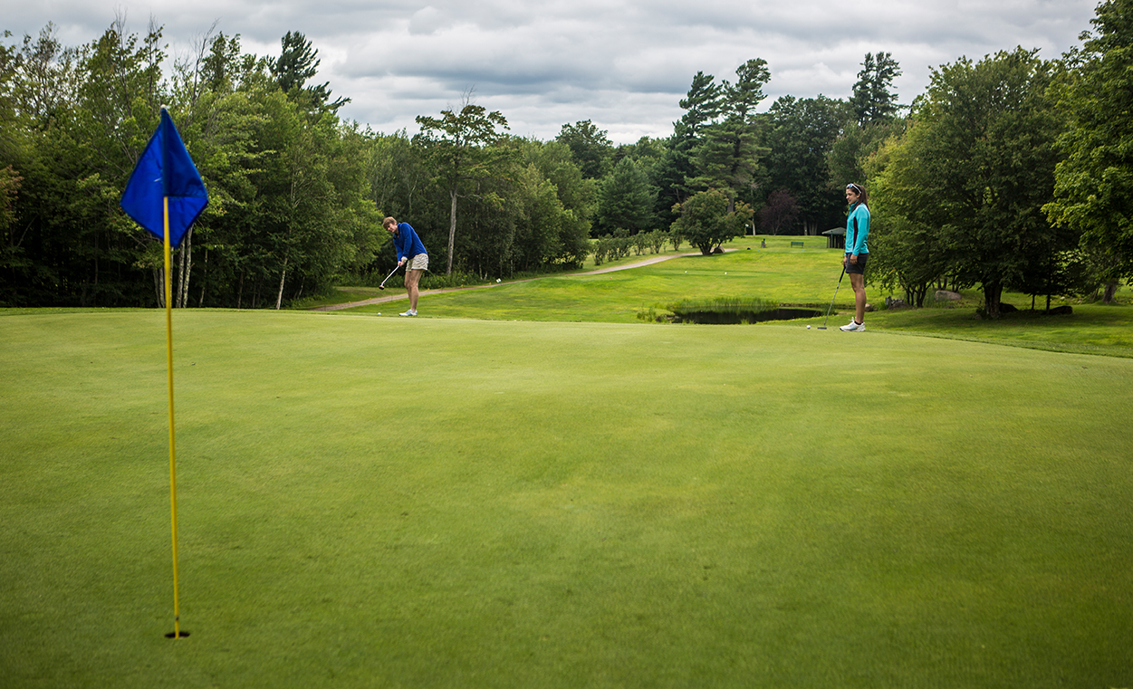 Putting on Tupper Lake's terrific greens.