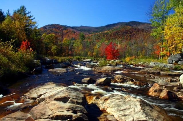 The Ausable River flows right past McDougall's deck.