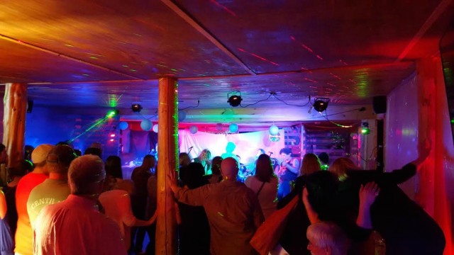 An '80s cover band performing at Bitters & Bones.
