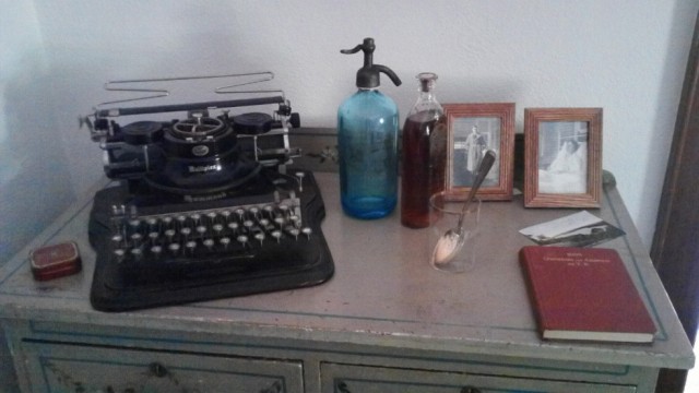 writing letters and looking at photographs of loved ones were often the only contact with family A typewriter and photos sit on a desk