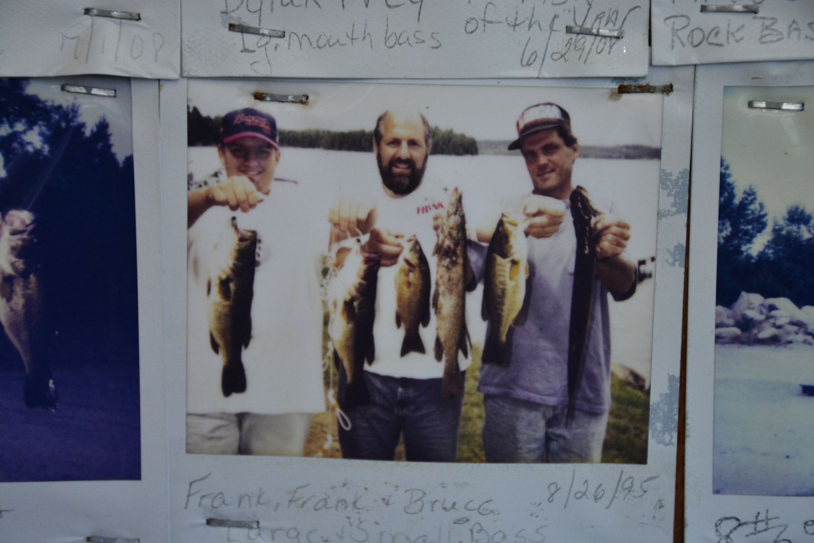Frank Scotti, center, and his son Frank, left, and Bruce, right, showing off their catches of the day in a photo taken in 1995 that hangs on the Blue Jay Campsite store wall.