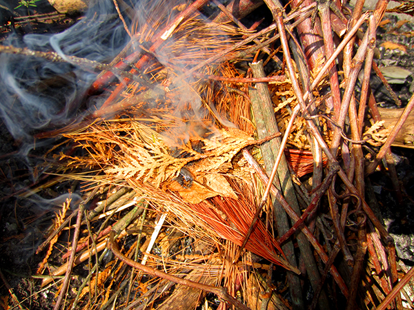 A flame appears out of the smoke