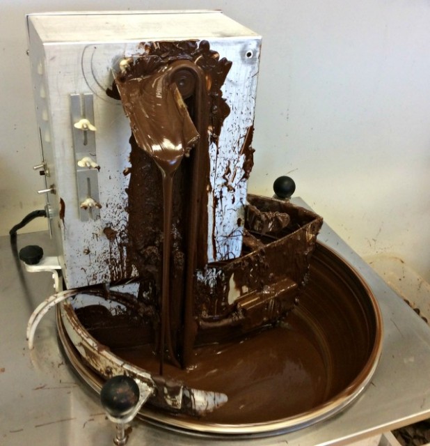This is an enrobing device, for dipping and decorating. Admit it: we all want one!