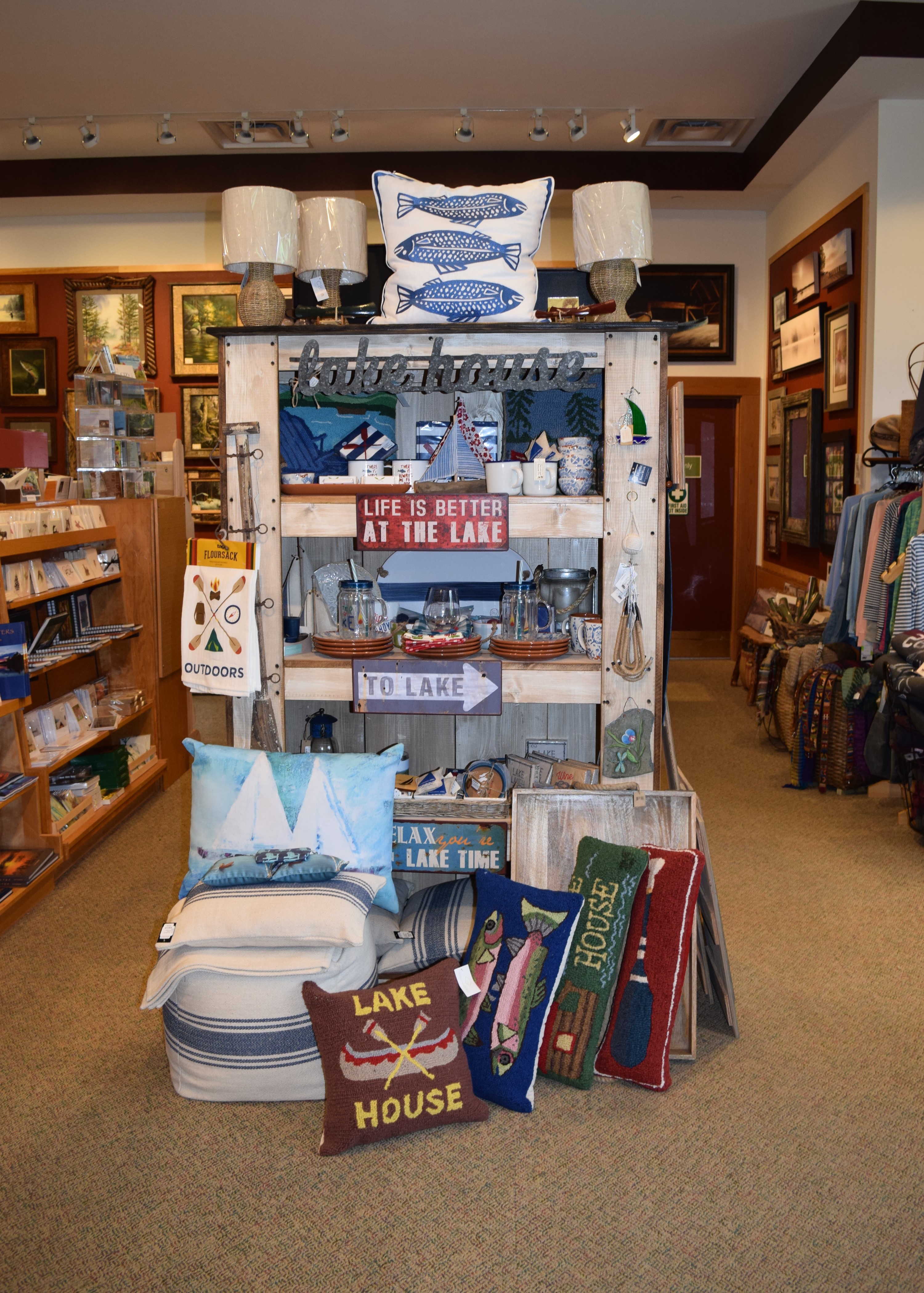 A shelf full of Adirondack decor in a store.