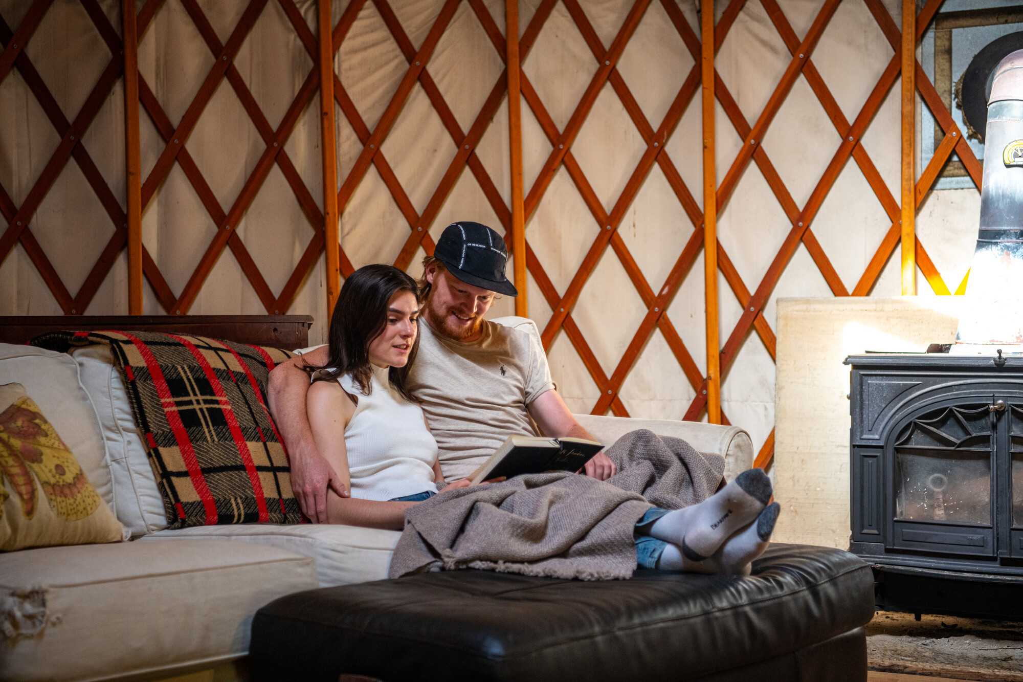 Couple sitting in Blue Pepper Farm yurt