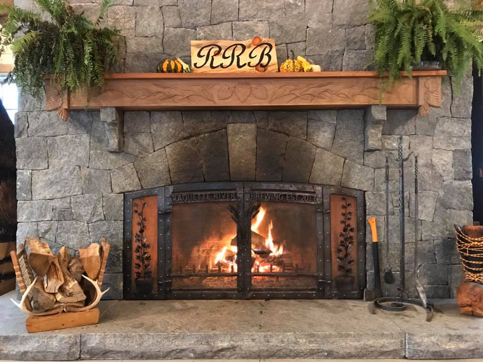 Dan's work can be seen on these fireplace door at Raquette River Brewing.