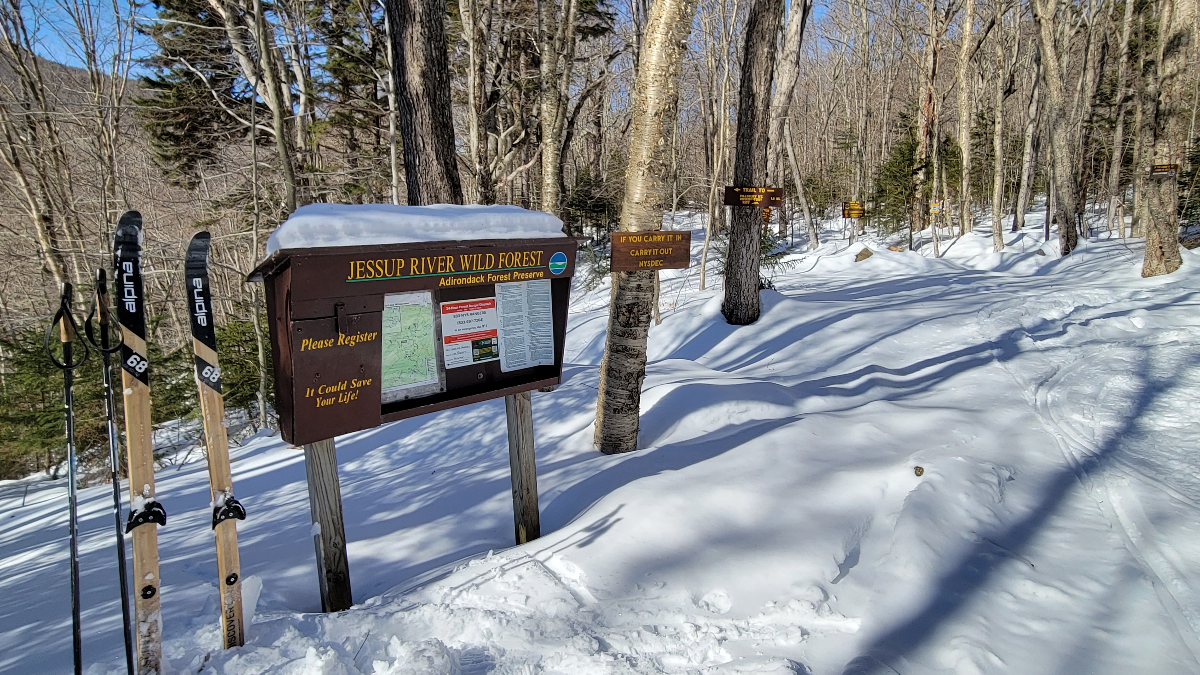 Skis and poles next to Pilllsbury Mountain trail register