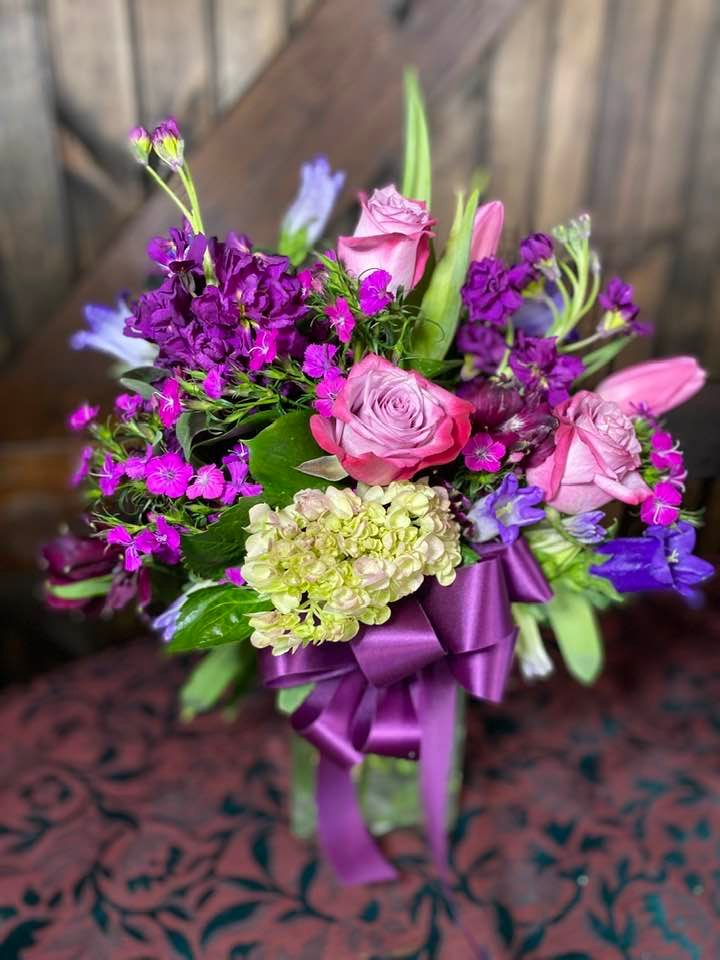 A large, colorful bouquet of flowers in a vase.