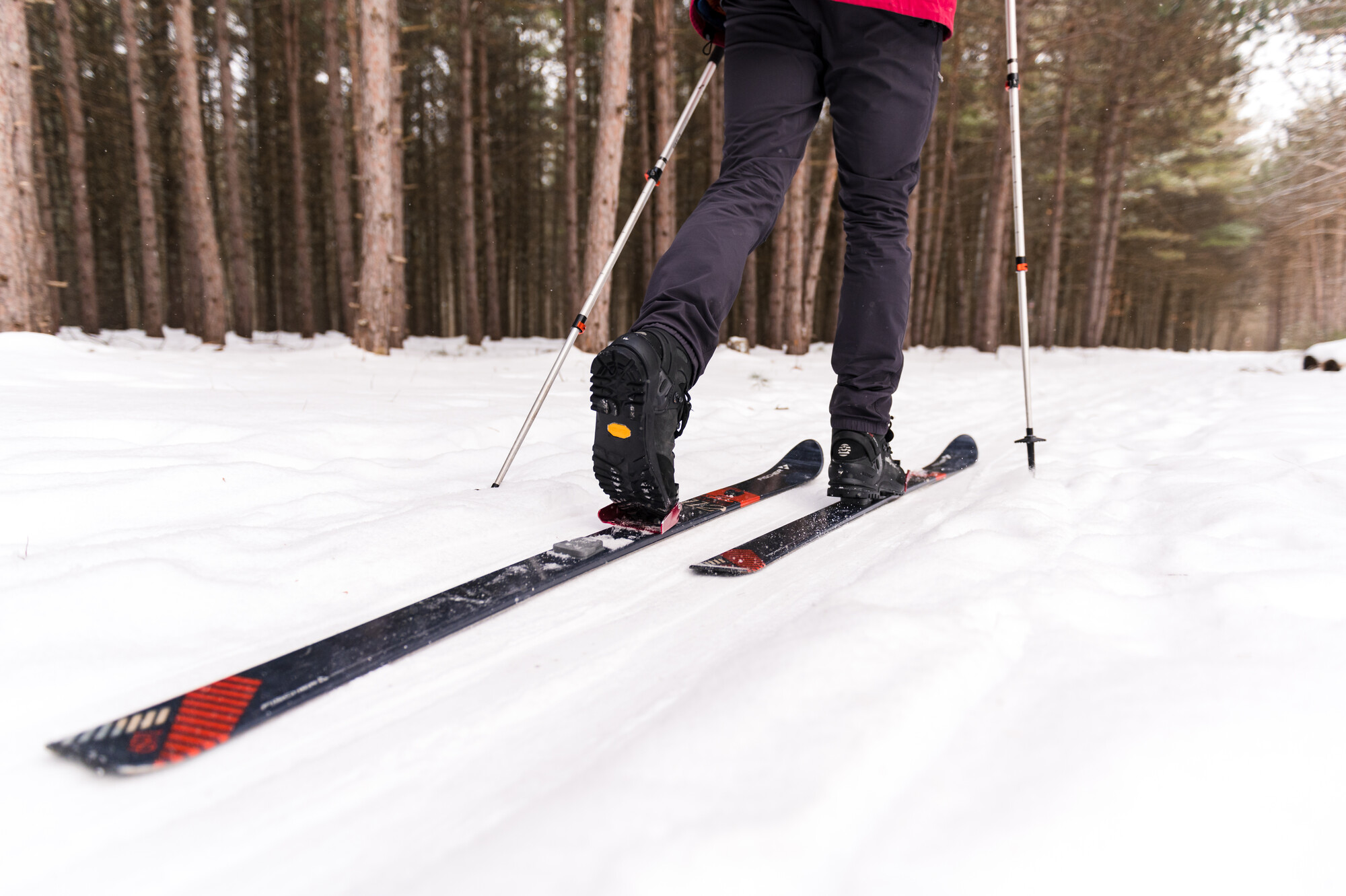 A skier glides on packed snow