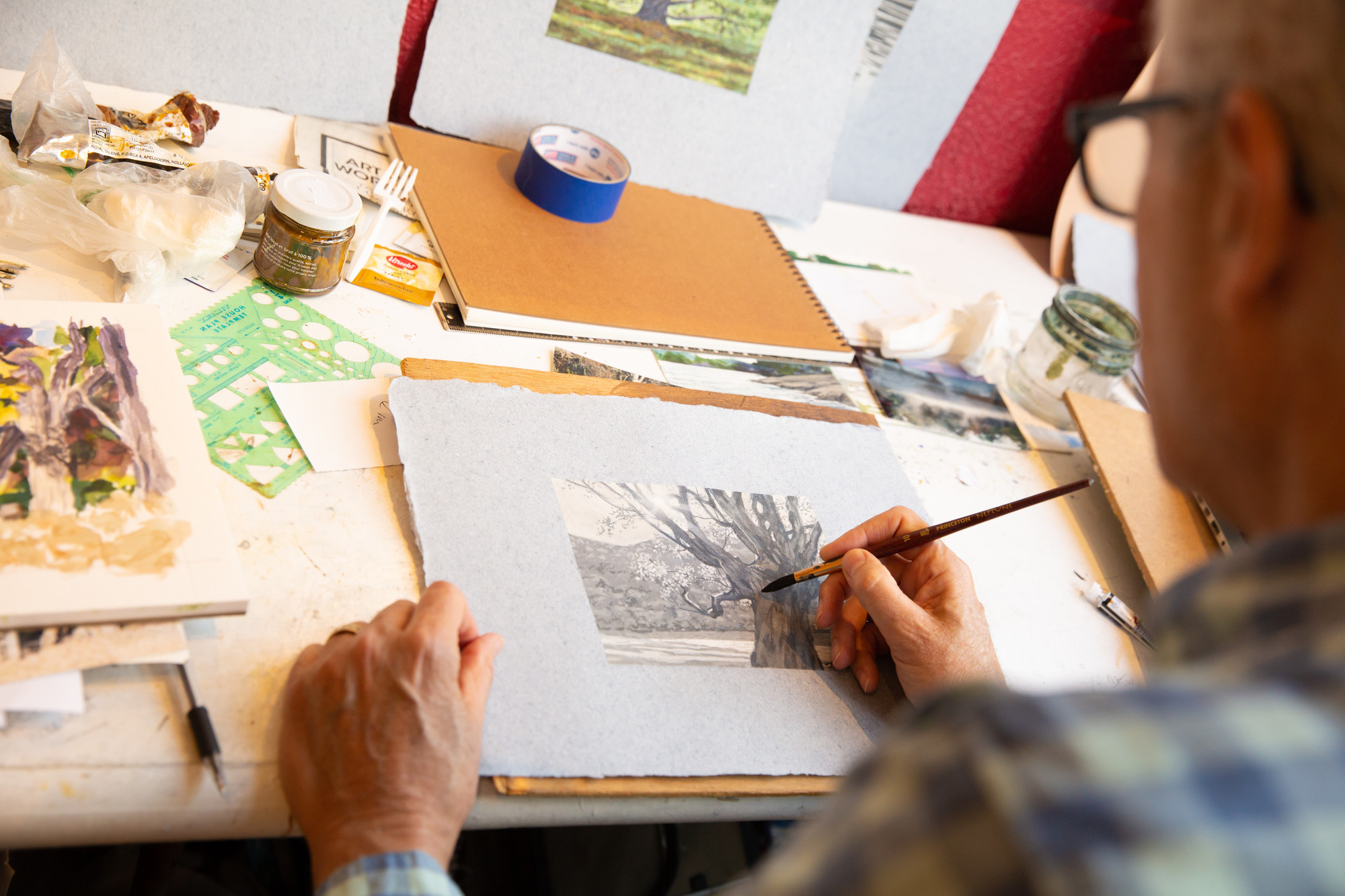 A local artist working on watercolor painting.