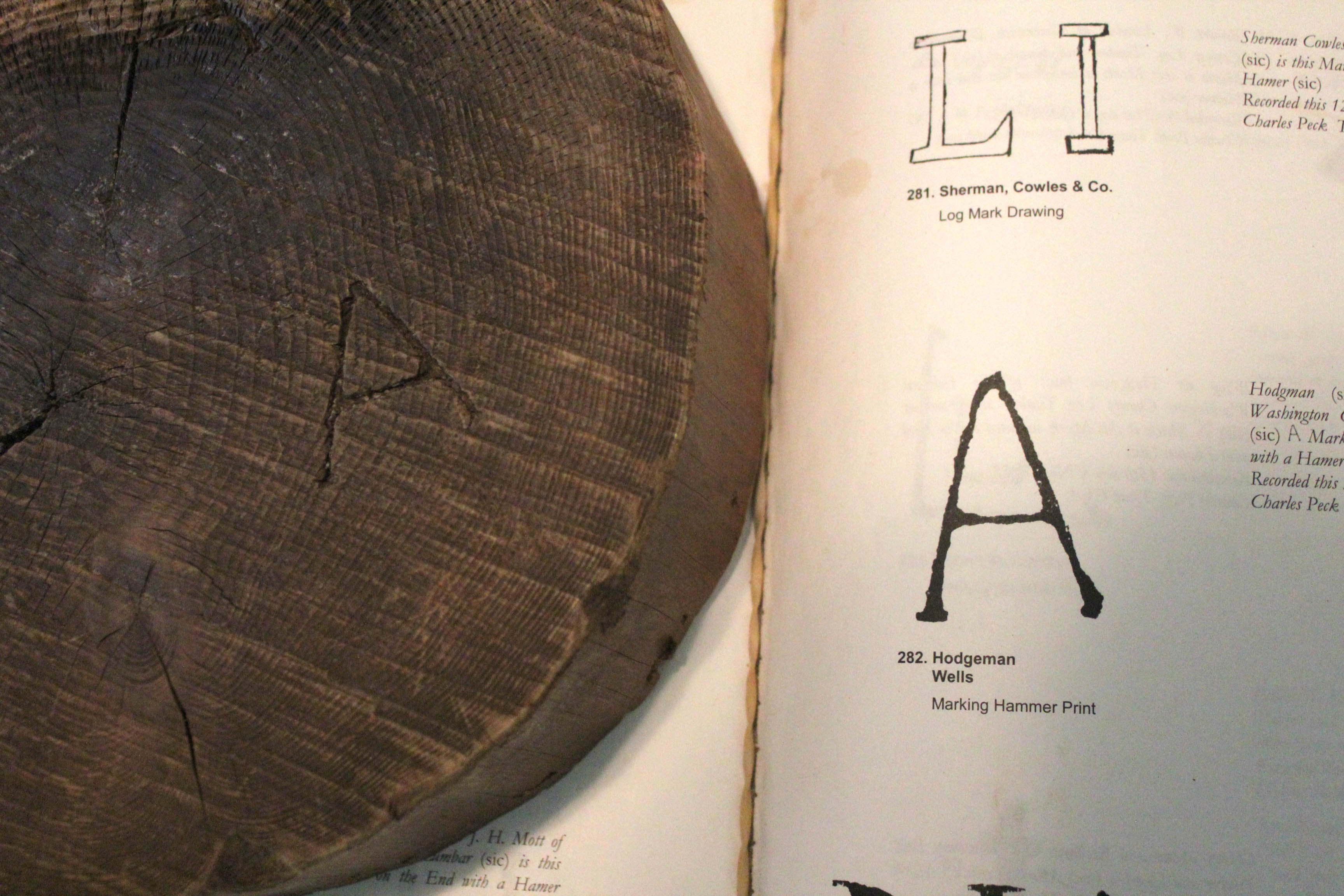 Back in the old days, log marks were pounded into each log so the company it belonged to could be identified downriver.
