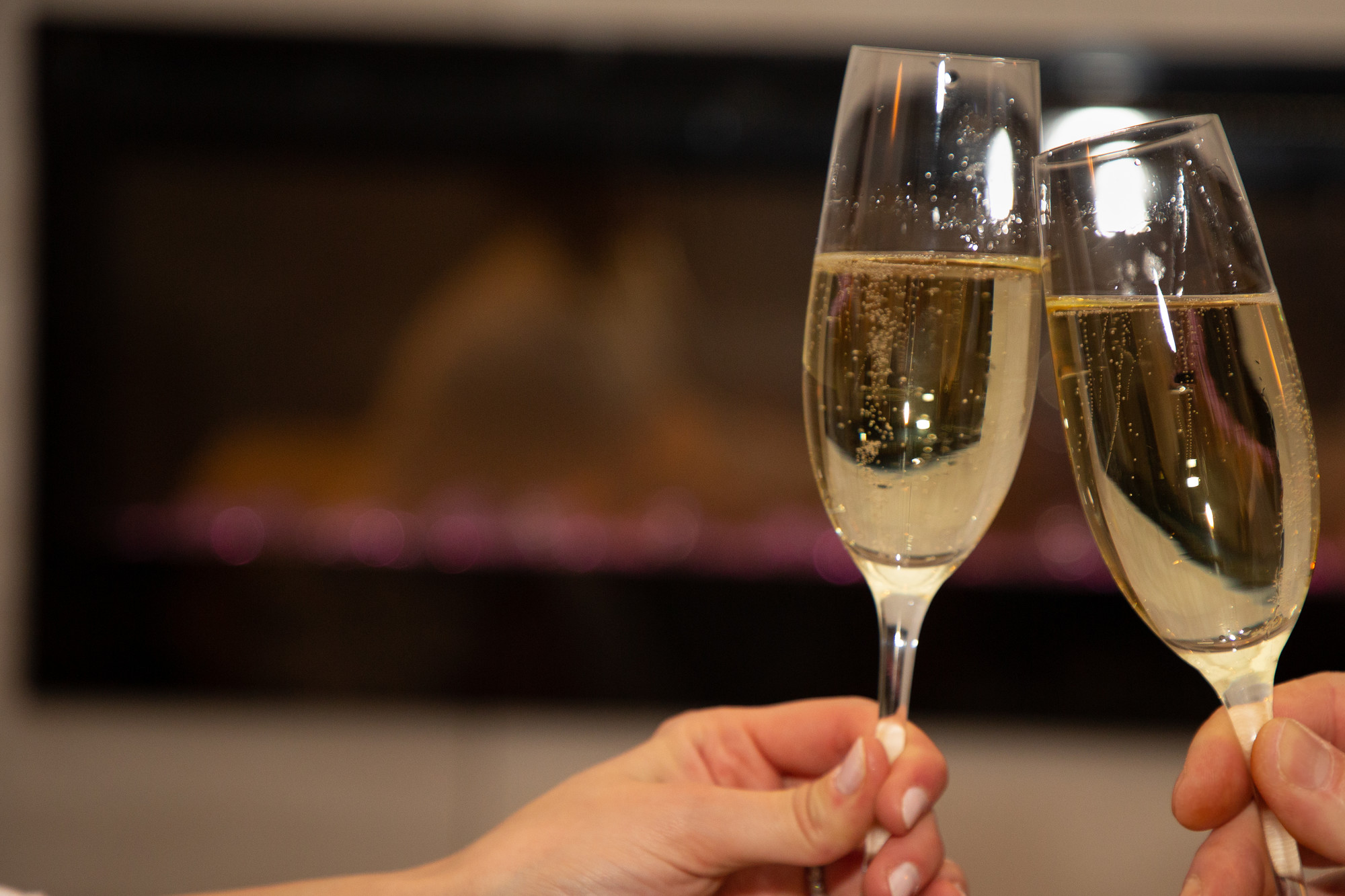 Two champagne glasses toasting the new year
