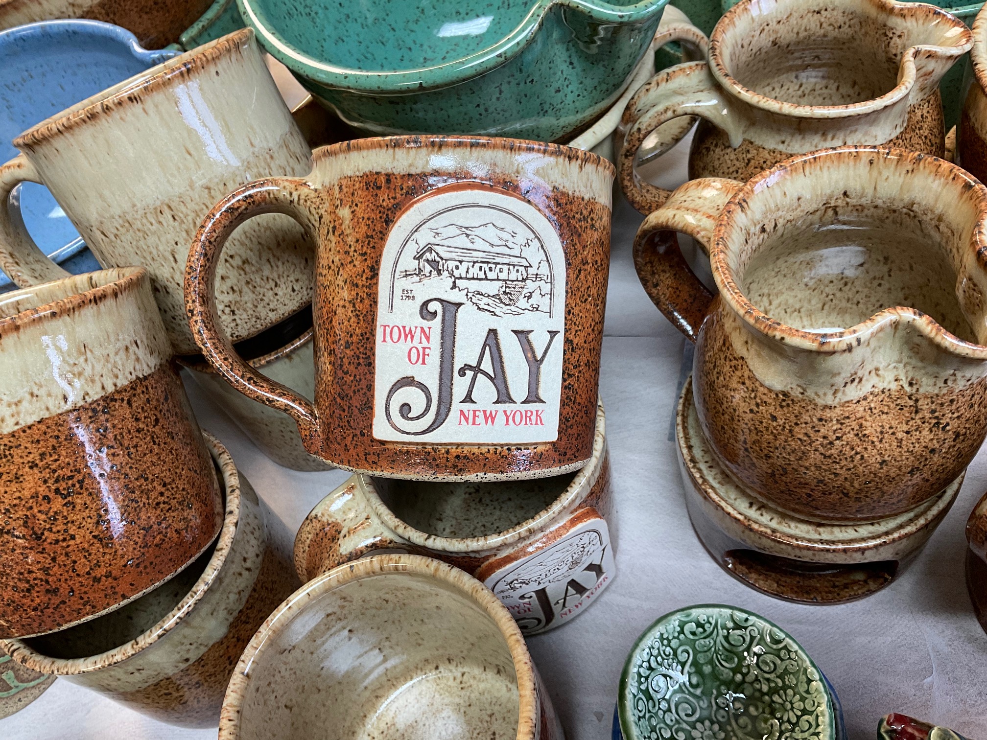 A collection of rustic mugs from Jay Craft Center.