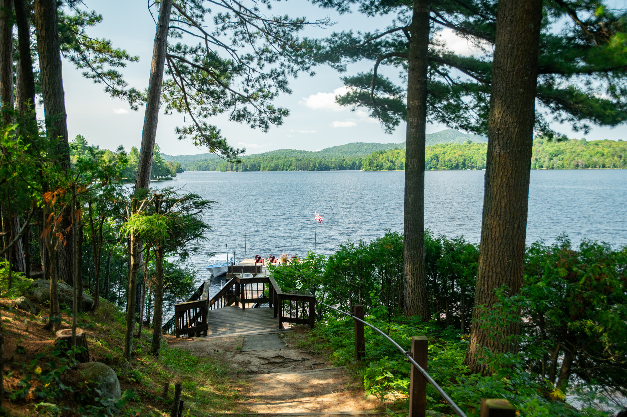 Summer view of a lake with a wooden dock