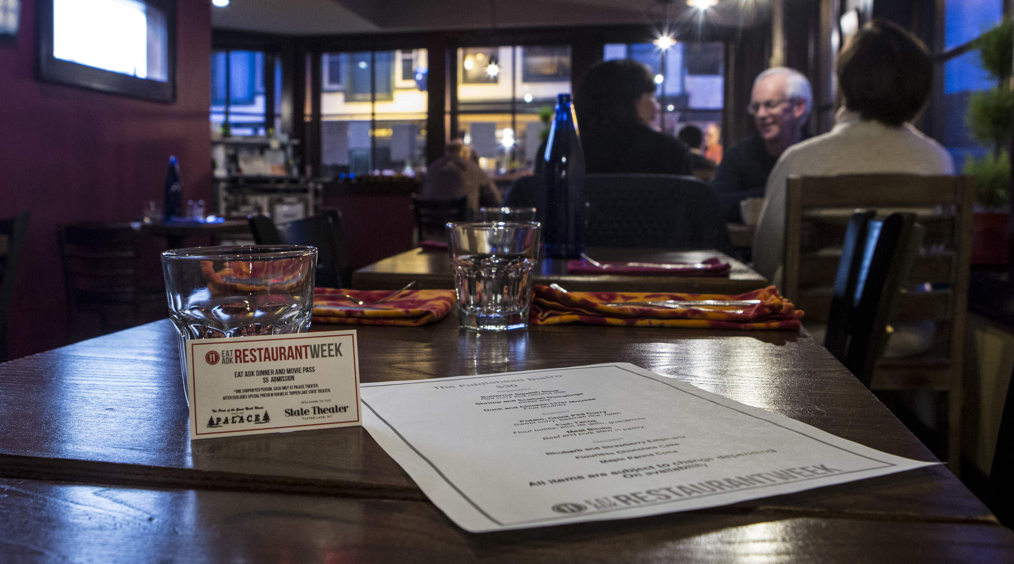 Fine dining done right this fall at Fiddlehead Bistro Friends dining. Tables, chairs, and windows that view the street.