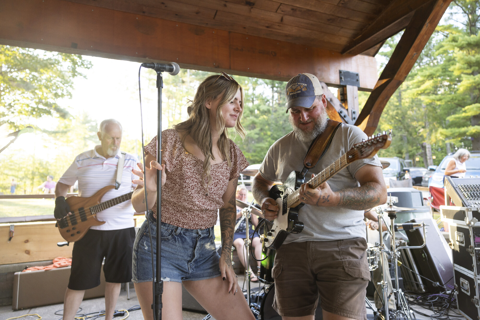 Two people playing music in a pavilian