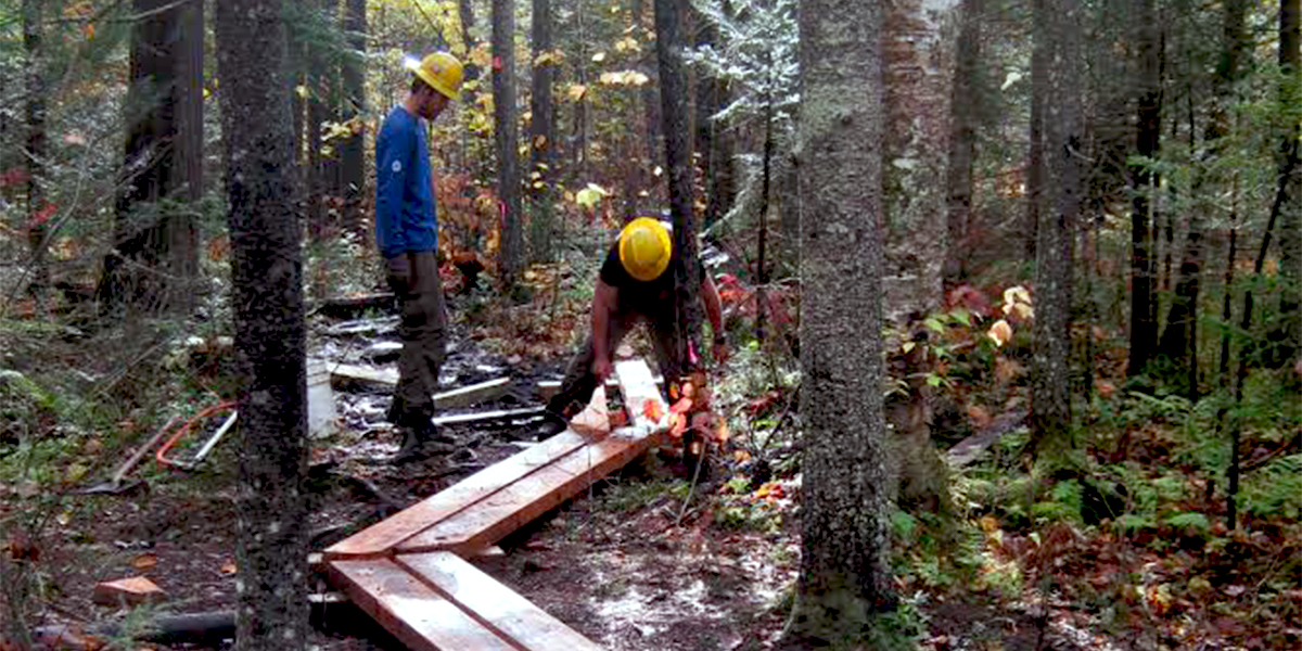 SCA crew builds bog bridging on the OK Slip Falls Trail in 2014 (Allison Buckley photo)