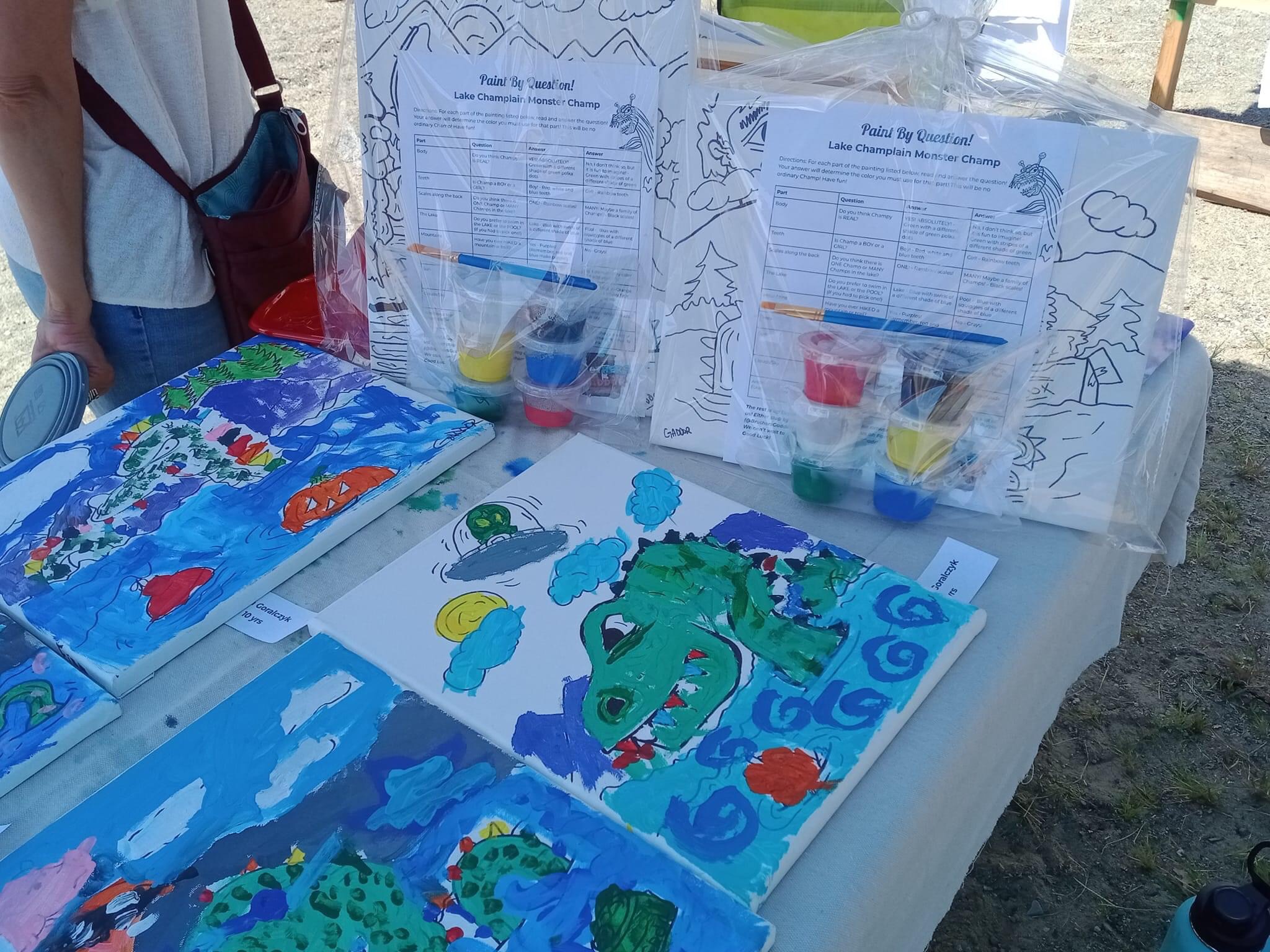 "Paint your own Champ" craft kits sit on a table. 
