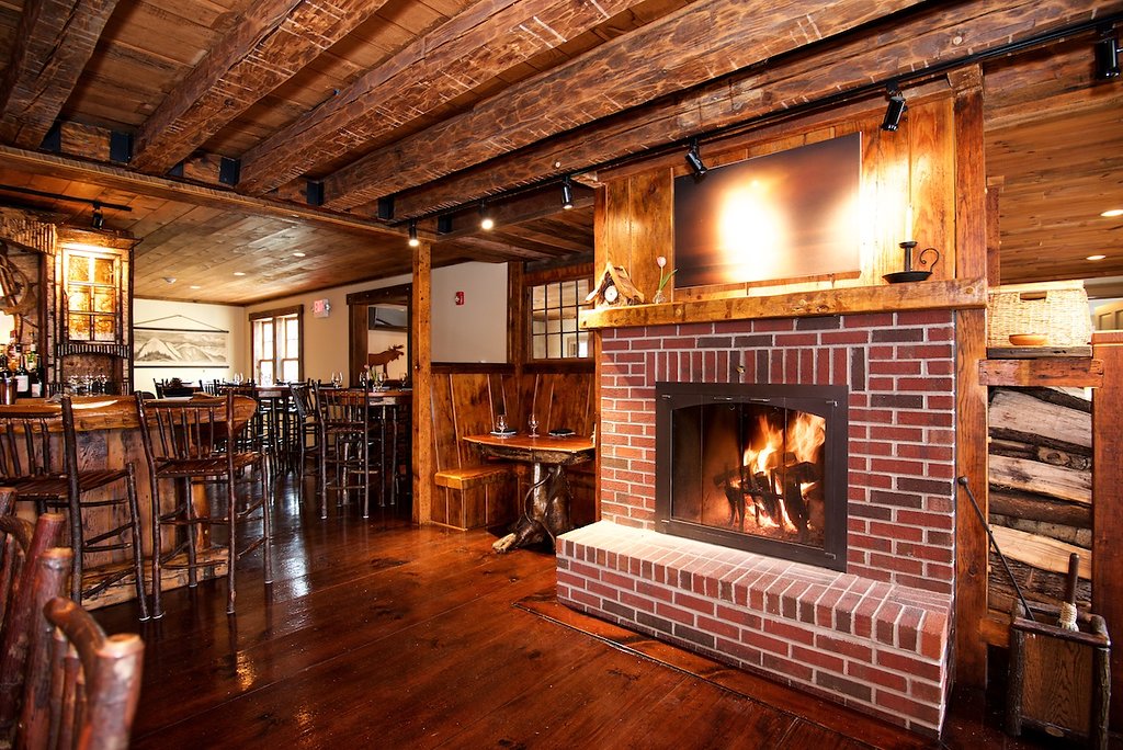 A roaring fire in the fireplace of the Essex Inn dining room
