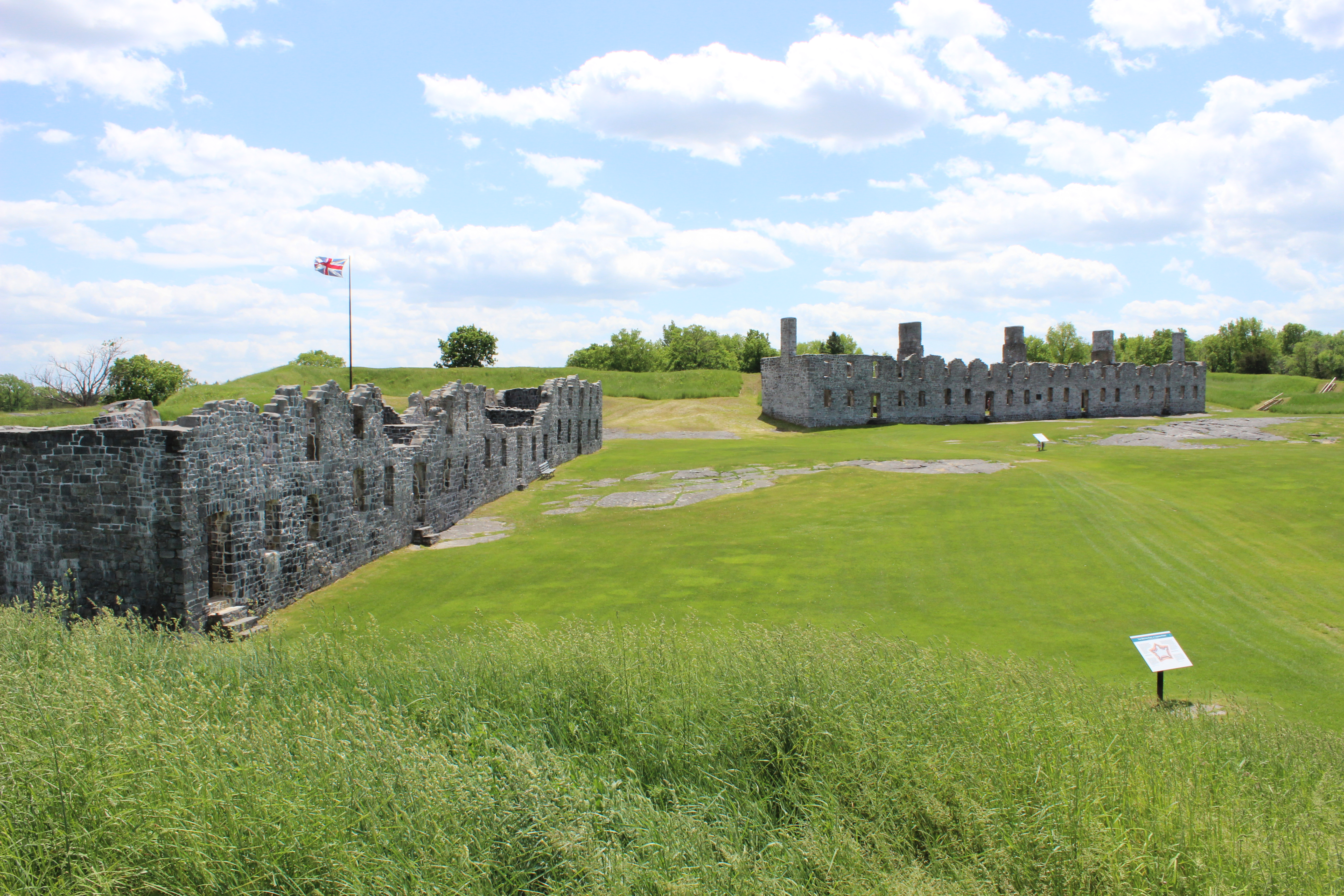 Ruins of a revolutionary war fort in a field.