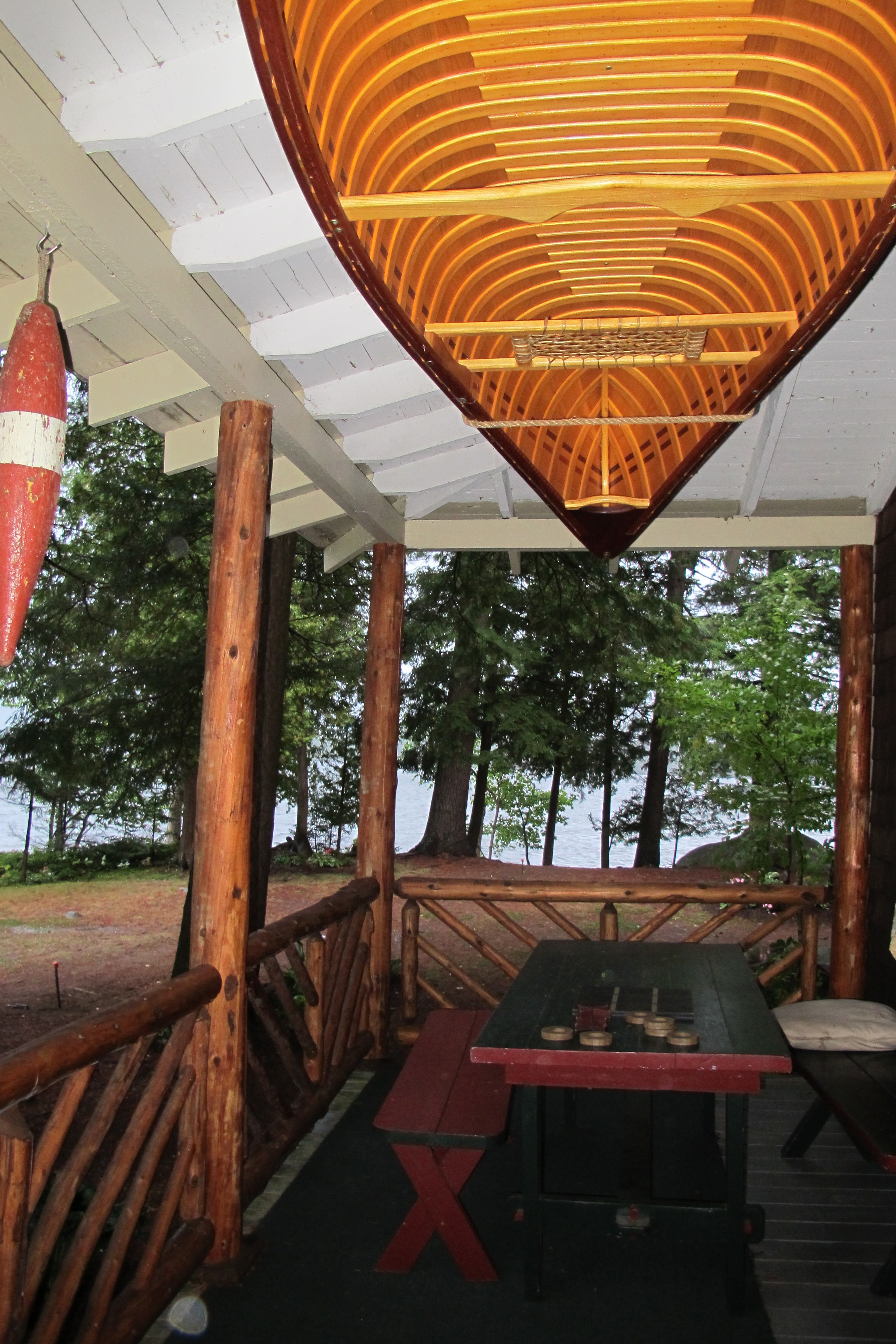 Front porch of the main building at The Hedges overlooking Blue Mountain Lake